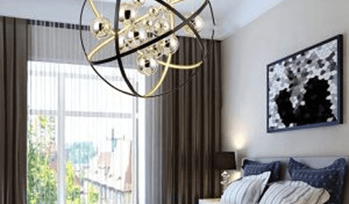 Stylish bedroom interior with chandelier and window