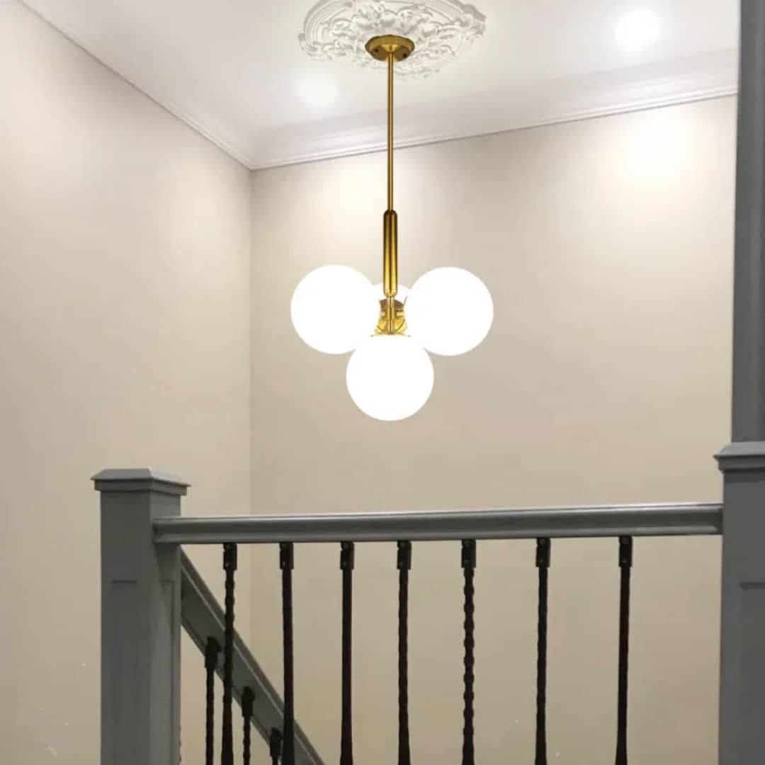 Nordic 4-Globe Stairwell Pendant Light – Brass & Frosted Glass Ceiling Fixture. - View 1